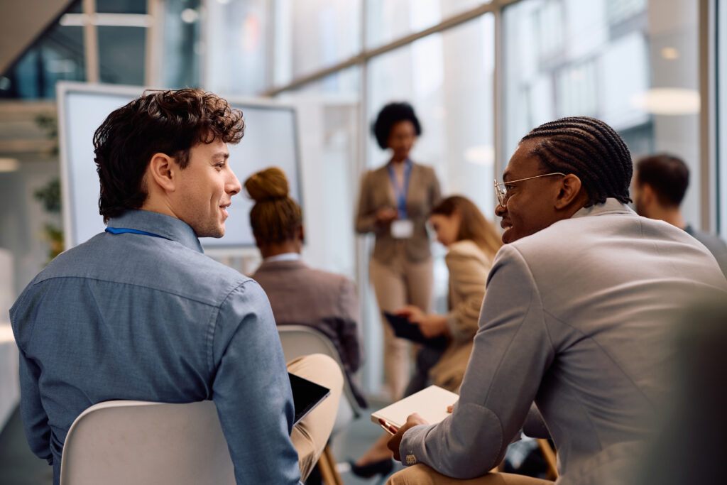Two professionals talking about career development.